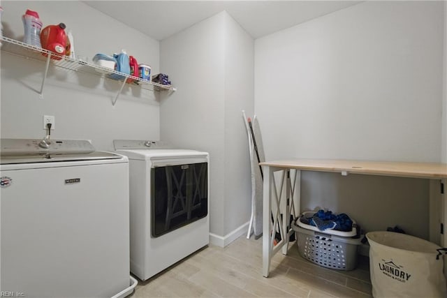 1028 Egret Ln, Suffolk, VA 23434 - laundry area with washing machine and clothes dryer, light wood-style flooring, and baseboards