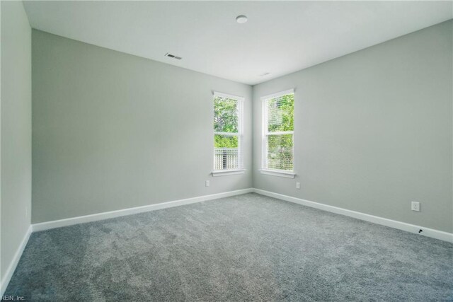 1028 Egret Ln, Suffolk, VA 23434 - spare room featuring baseboards and carpet floors