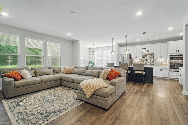 1028 Egret Ln, Suffolk, VA 23434 - living area featuring light wood finished floors and recessed lighting