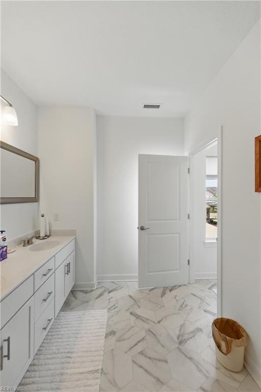 605 Middleton Way, Chesapeake, VA 23322 - bathroom featuring marble look tile flooring, vanity, and baseboards