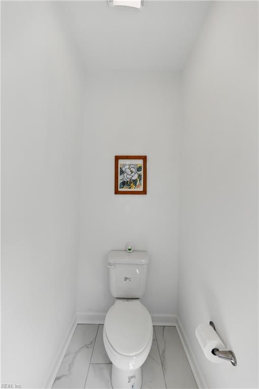 605 Middleton Way, Chesapeake, VA 23322 - bathroom featuring marble look tile flooring, baseboards, and toilet