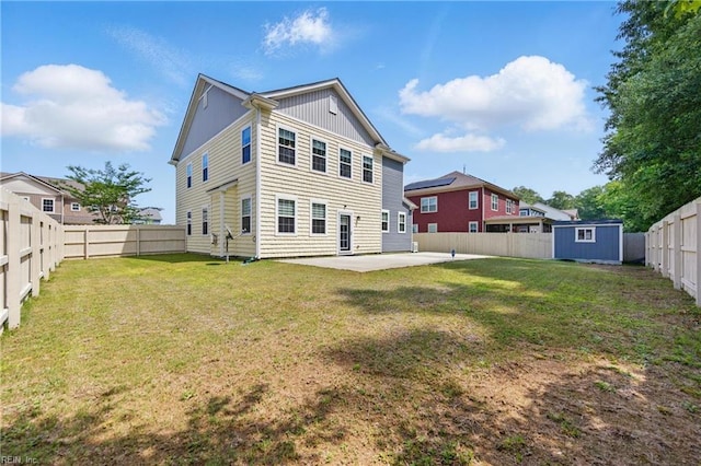 605 Middleton Way, Chesapeake, VA 23322 - rear view of property with a patio area, a storage unit, an outbuilding, and board and batten siding
