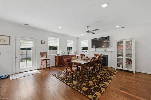 605 Middleton Way, Chesapeake, VA 23322 - dining area with ornamental molding, ceiling fan, a glass covered fireplace, dark wood-type flooring, and recessed lighting