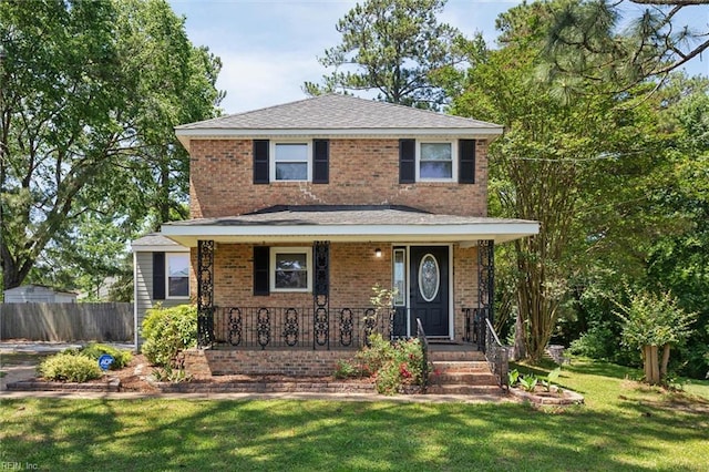 view of front of home with brick siding and a porch
