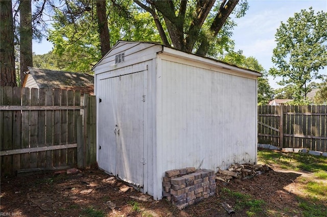 view of shed featuring a fenced backyard