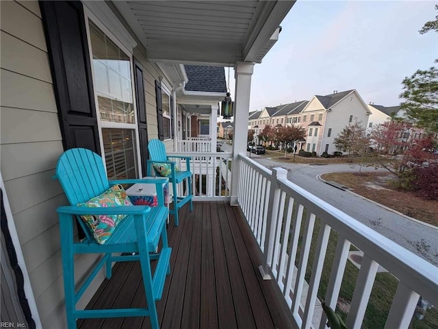 balcony featuring a porch and a residential view