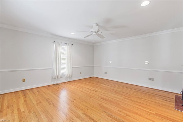 spare room featuring a ceiling fan, light wood-type flooring, ornamental molding, recessed lighting, and baseboards