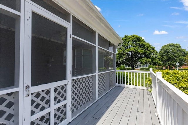 wooden terrace with a sunroom