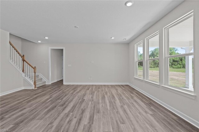 224 Preserve Way, Suffolk, VA 23434 - empty room featuring stairs, wood finished floors, baseboards, and recessed lighting