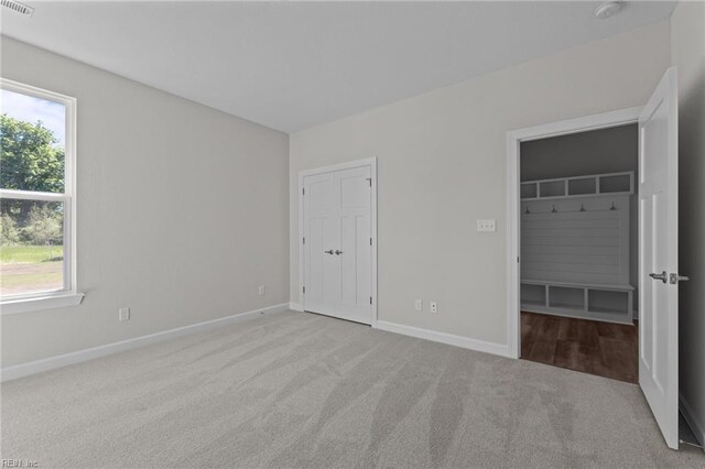 224 Preserve Way, Suffolk, VA 23434 - unfurnished bedroom with carpet flooring, multiple windows, and baseboards