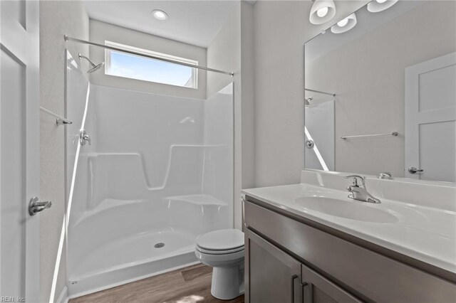 224 Preserve Way, Suffolk, VA 23434 - bathroom featuring wood finished floors, toilet, a shower, and vanity