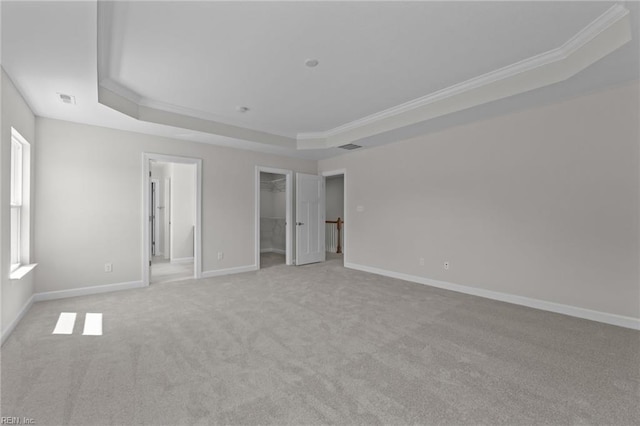 224 Preserve Way, Suffolk, VA 23434 - unfurnished bedroom with a raised ceiling, light carpet, ornamental molding, a walk in closet, and baseboards