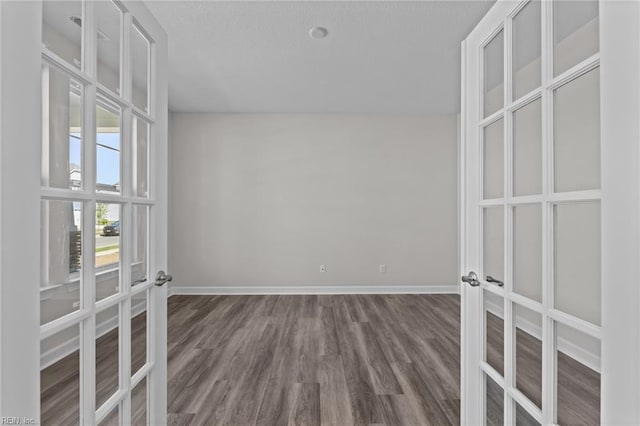 224 Preserve Way, Suffolk, VA 23434 - empty room with french doors, baseboards, and dark wood-style flooring