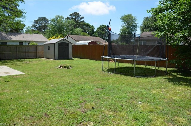 703 Houston Ave, Hampton, VA 23669 - view of yard featuring a trampoline, a shed, and an outdoor structure