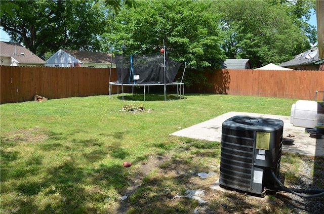 703 Houston Ave, Hampton, VA 23669 - view of yard featuring central air condition unit and a trampoline