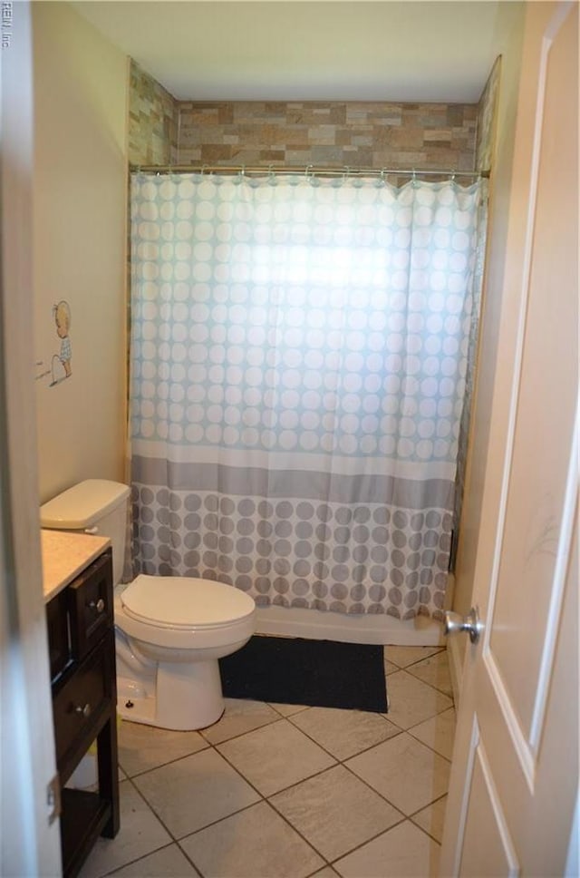 703 Houston Ave, Hampton, VA 23669 - full bath featuring tile patterned flooring, a shower with curtain, toilet, and vanity