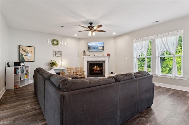 110 Sea Hero Ct, Suffolk, VA 23435 - living room featuring dark wood-style floors, ceiling fan, a lit fireplace, baseboards, and recessed lighting