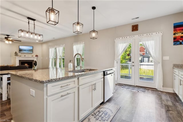 110 Sea Hero Ct, Suffolk, VA 23435 - kitchen featuring a sink, dishwasher, a ceiling fan, dark wood-style flooring, and healthy amount of natural light