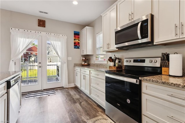 110 Sea Hero Ct, Suffolk, VA 23435 - kitchen with stainless steel appliances, dark wood-style floors, white cabinetry, french doors, and light stone countertops
