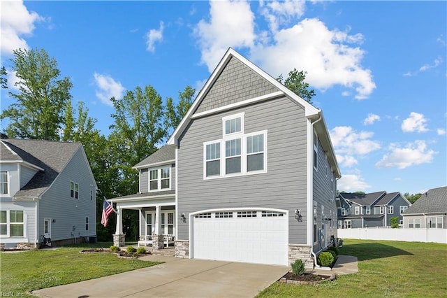 110 Sea Hero Ct, Suffolk, VA 23435 - craftsman house featuring an attached garage, driveway, stone siding, and covered porch