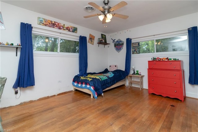 101 Stadium Dr, Chesapeake, VA 23322 - bedroom with wood finished floors and a ceiling fan