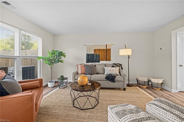 living room featuring wood finished floors and baseboards