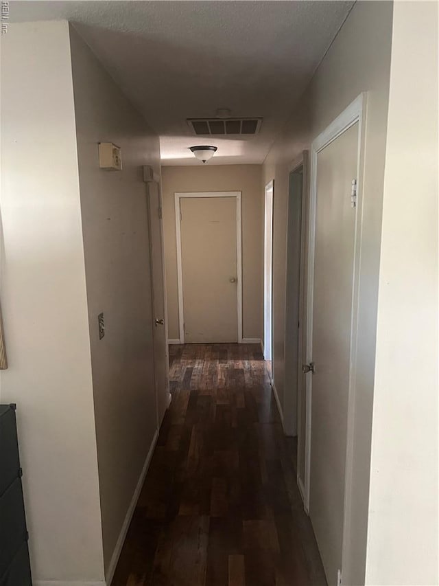 hallway featuring wood finished floors