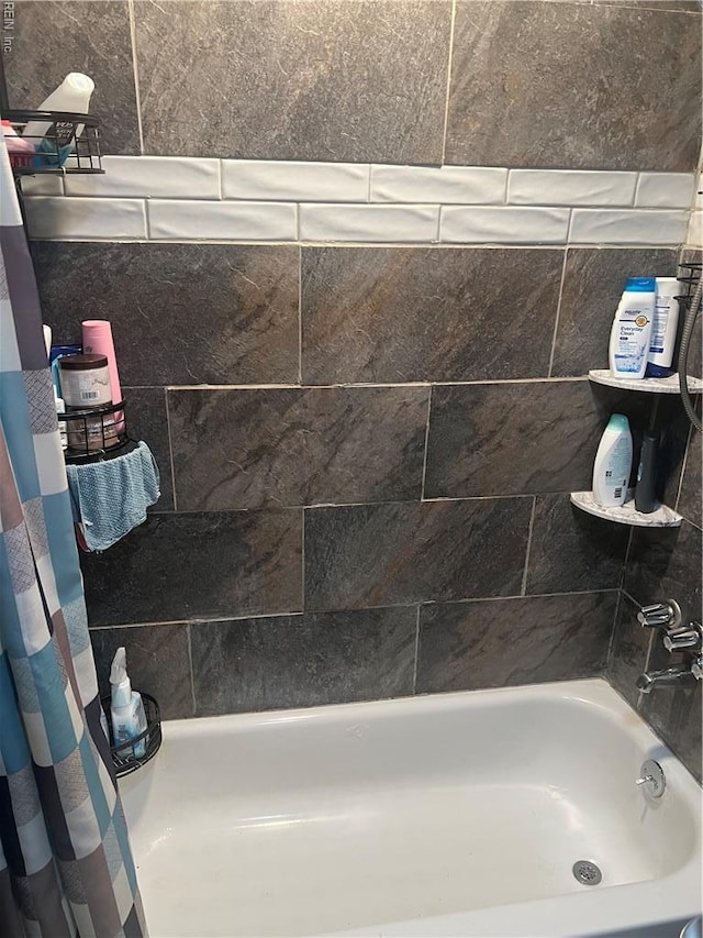 bathroom featuring shower / bath combination with curtain