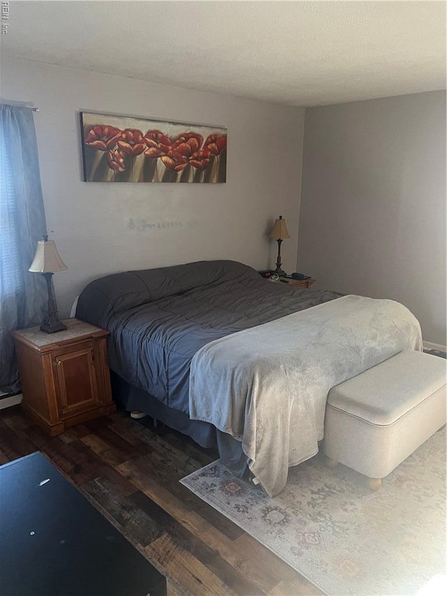 bedroom featuring wood finished floors