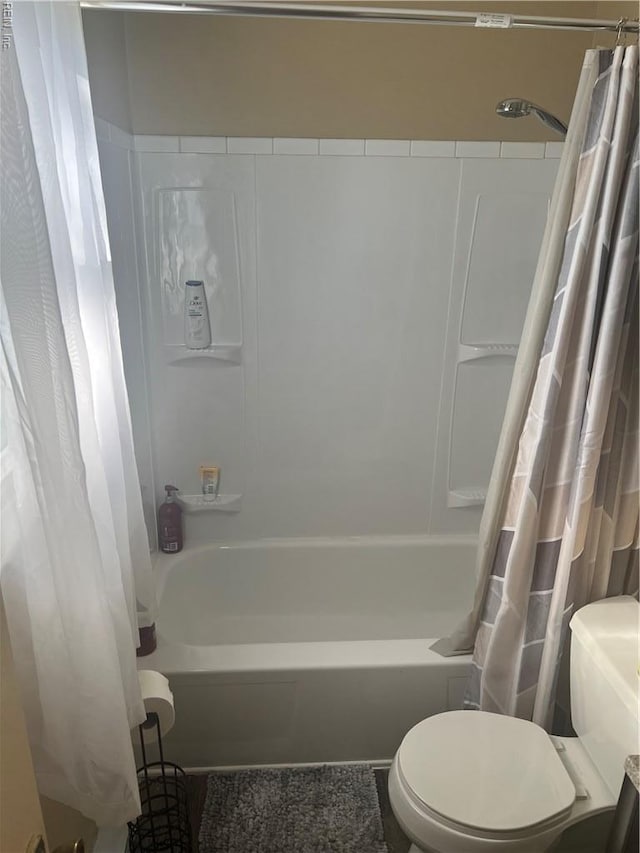 full bath with toilet and shower / tub combo