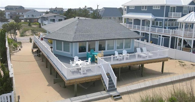 3616 Sandfiddler Rd, Virginia Beach, VA 23456 - rear view of house with a wooden deck, stairway, a sunroom, a residential view, and roof with shingles