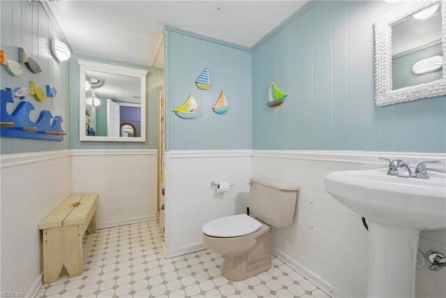 3616 Sandfiddler Rd, Virginia Beach, VA 23456 - bathroom with toilet, tile patterned floors, a sink, and wainscoting