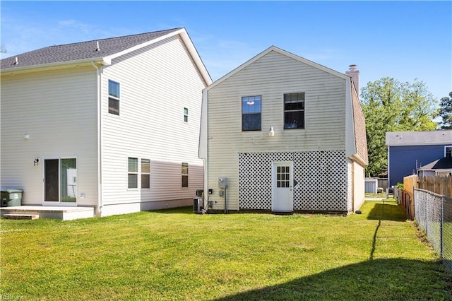 1048 Wilmington St, Norfolk, VA 23505 - rear view of house featuring a chimney and cooling unit