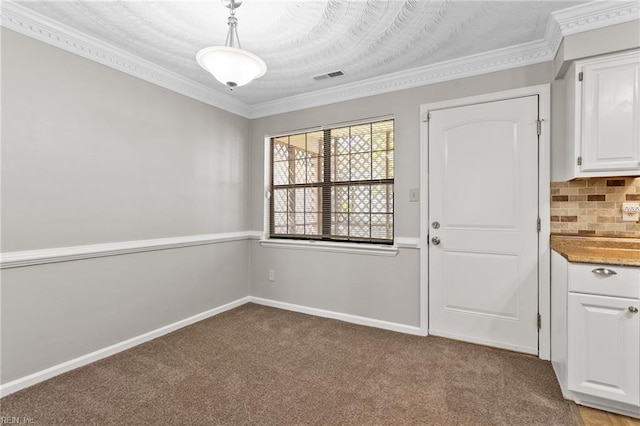 1048 Wilmington St, Norfolk, VA 23505 - unfurnished dining area featuring light colored carpet, crown molding, and baseboards