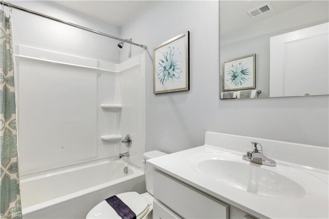 3905 Clyde St, Elizabeth City, NC 27909 - bathroom featuring toilet, shower / bath combo with shower curtain, and vanity