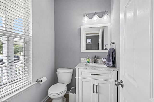 513 Simpson Ln, Chesapeake, VA 23323 - bathroom with toilet, vanity, and baseboards