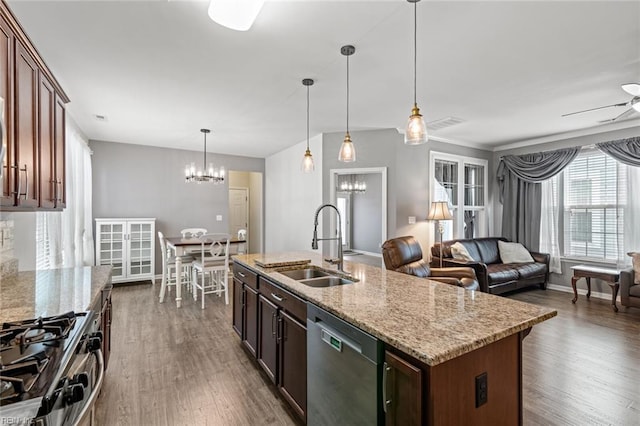 513 Simpson Ln, Chesapeake, VA 23323 - kitchen featuring appliances with stainless steel finishes, a sink, a chandelier, dark wood-style flooring, and ceiling fan