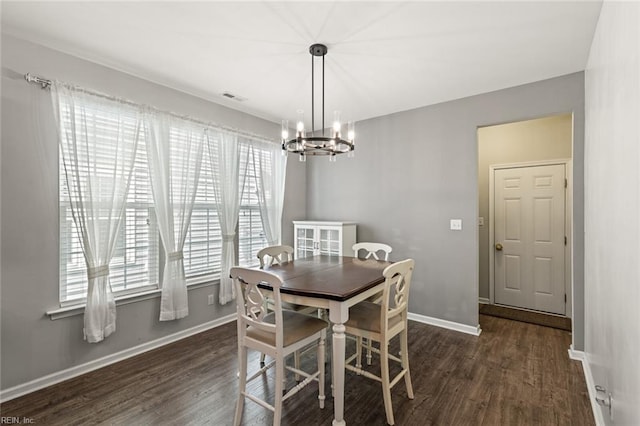 513 Simpson Ln, Chesapeake, VA 23323 - dining area with a chandelier, wood finished floors, and baseboards