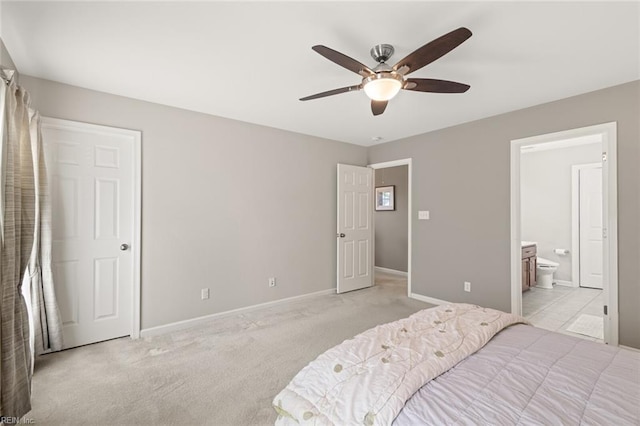 513 Simpson Ln, Chesapeake, VA 23323 - bedroom featuring baseboards, light colored carpet, ensuite bath, and ceiling fan