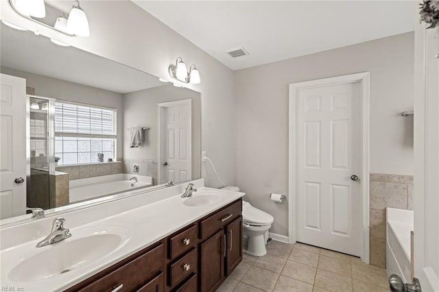513 Simpson Ln, Chesapeake, VA 23323 - bathroom with tile patterned flooring, toilet, a garden tub, and double vanity