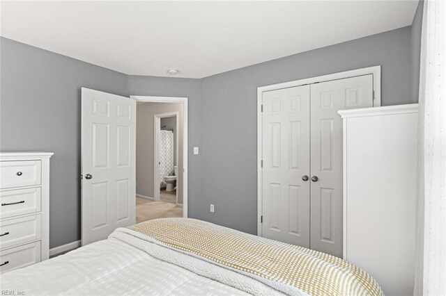 513 Simpson Ln, Chesapeake, VA 23323 - carpeted bedroom featuring a closet and baseboards