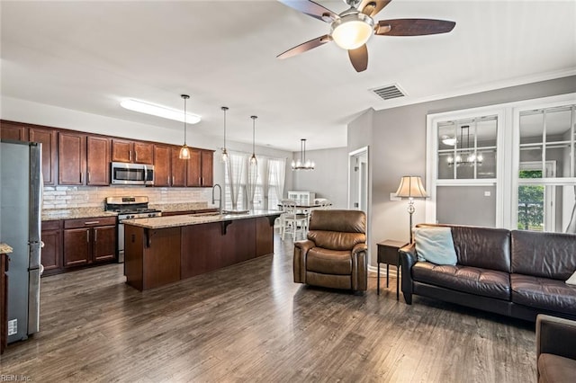 513 Simpson Ln, Chesapeake, VA 23323 - living area with a ceiling fan, a chandelier, and dark wood finished floors