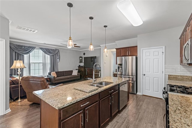 513 Simpson Ln, Chesapeake, VA 23323 - kitchen featuring appliances with stainless steel finishes, a sink, dark wood-style floors, and open floor plan