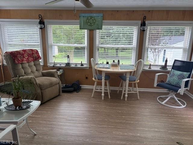 31154 Cardinal Ave, Franklin, VA 23851 - dining area featuring wood finished floors, baseboards, healthy amount of natural light, and wood walls