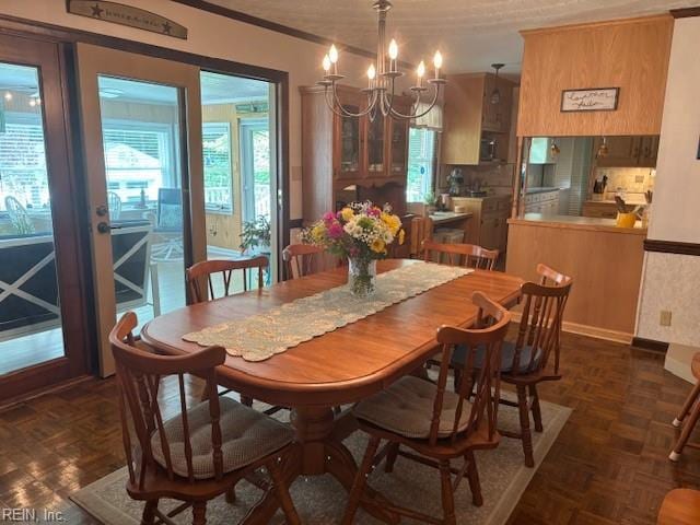 31154 Cardinal Ave, Franklin, VA 23851 - dining space with crown molding, a chandelier, and plenty of natural light