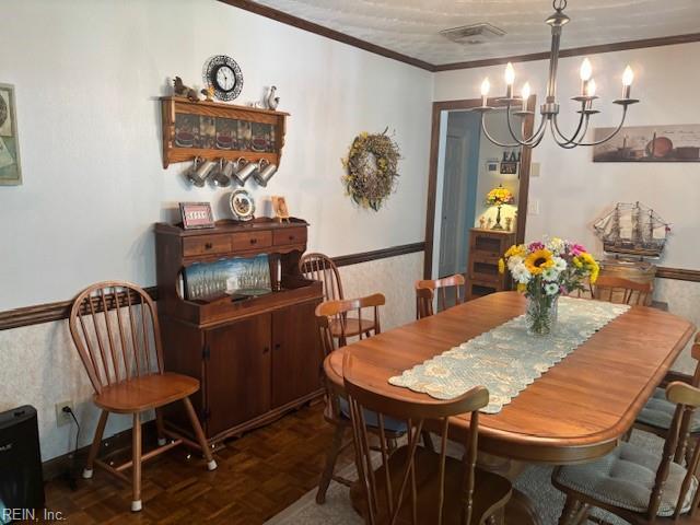 31154 Cardinal Ave, Franklin, VA 23851 - dining area featuring a chandelier and ornamental molding