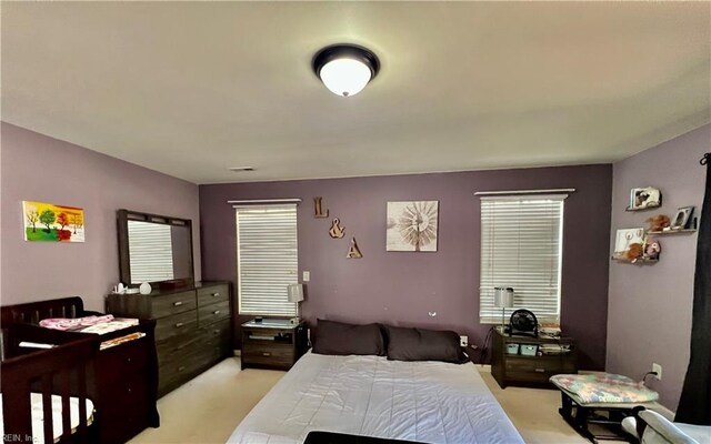 bedroom with light carpet