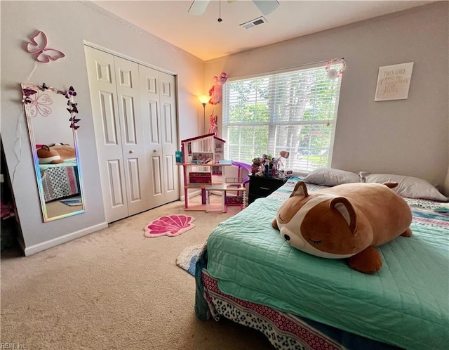 bedroom with carpet, a closet, a ceiling fan, and baseboards
