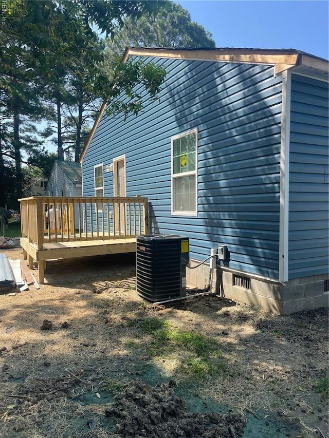 712 Norfleet St, Franklin, VA 23851 - back of house with central air condition unit, a wooden deck, and crawl space