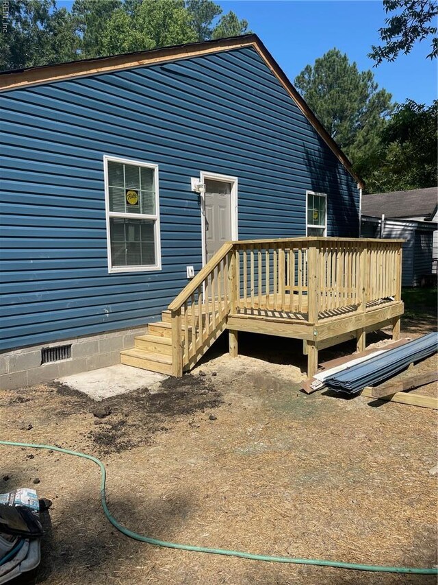 712 Norfleet St, Franklin, VA 23851 - back of property featuring a wooden deck and crawl space